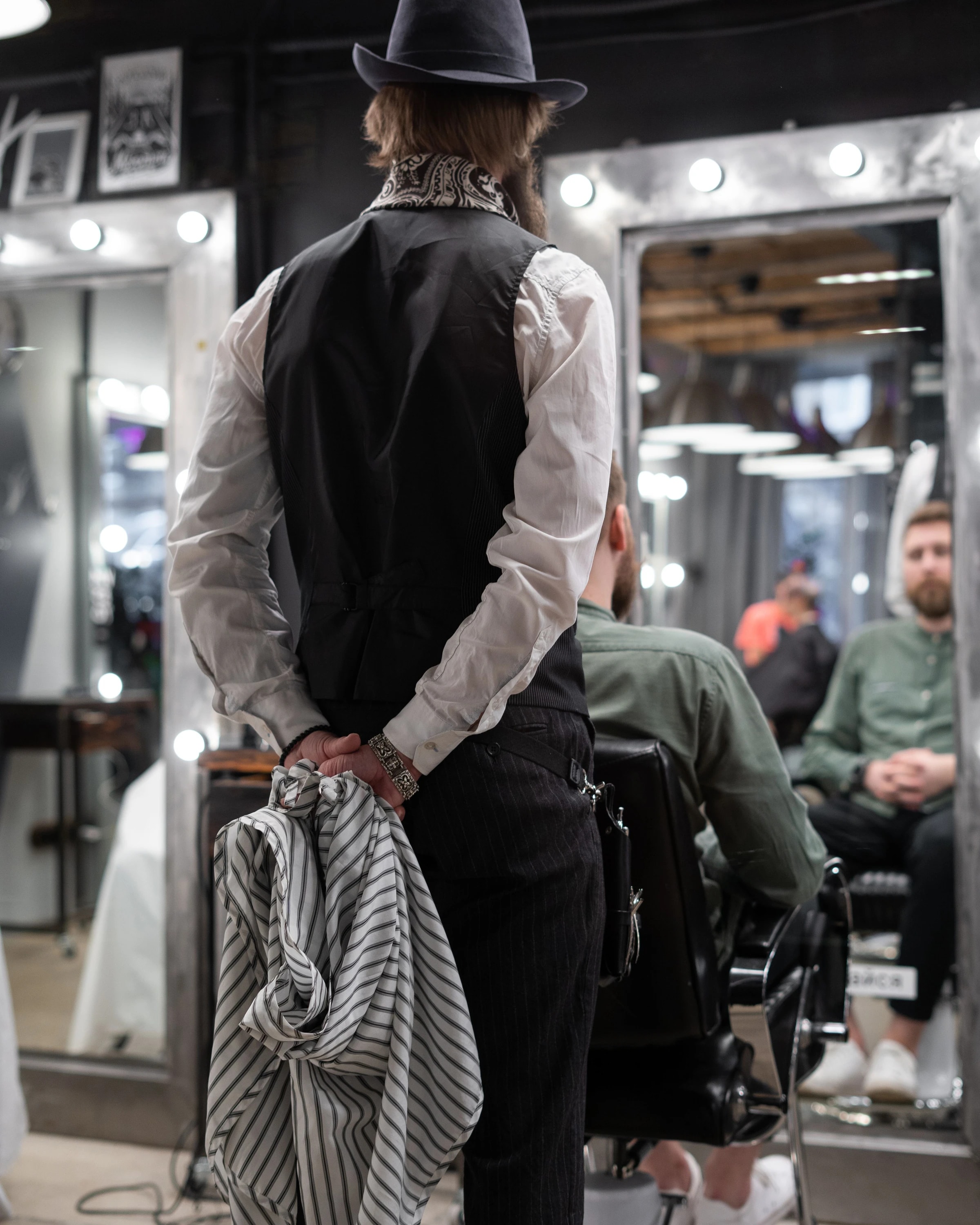 A traditional barber at work inside Fade House